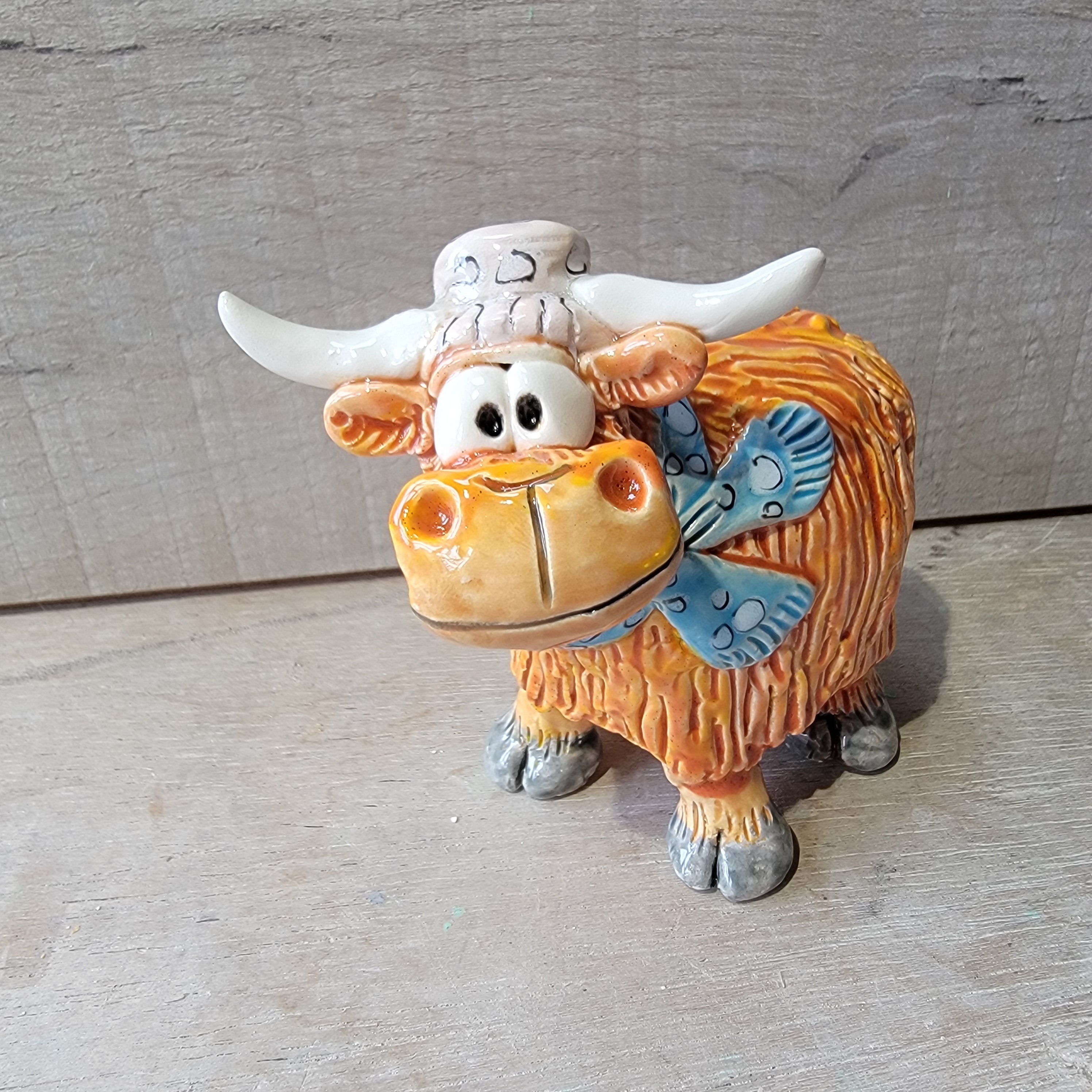 Little Highland cow, hat and scarf