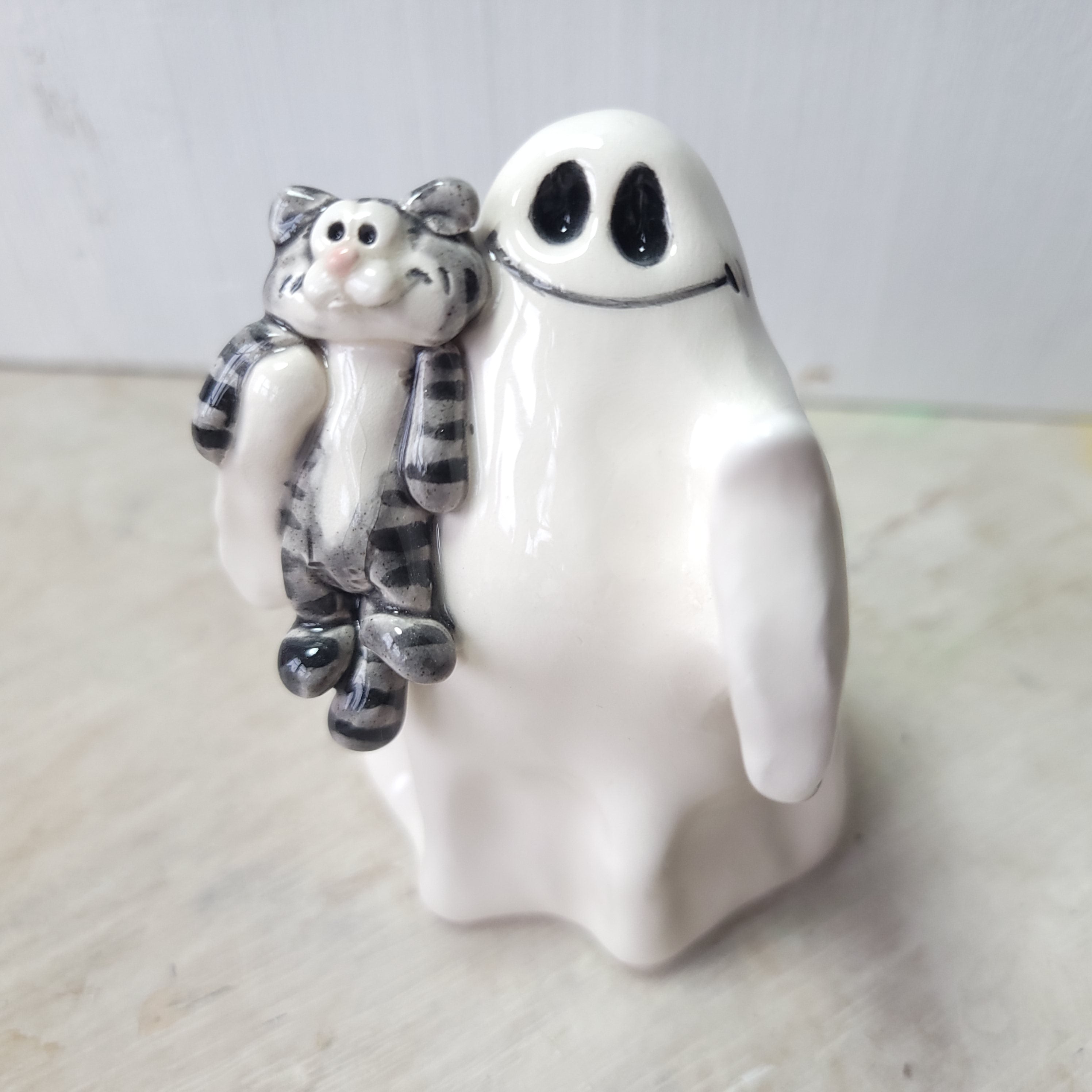 Ghost and tabby cat
