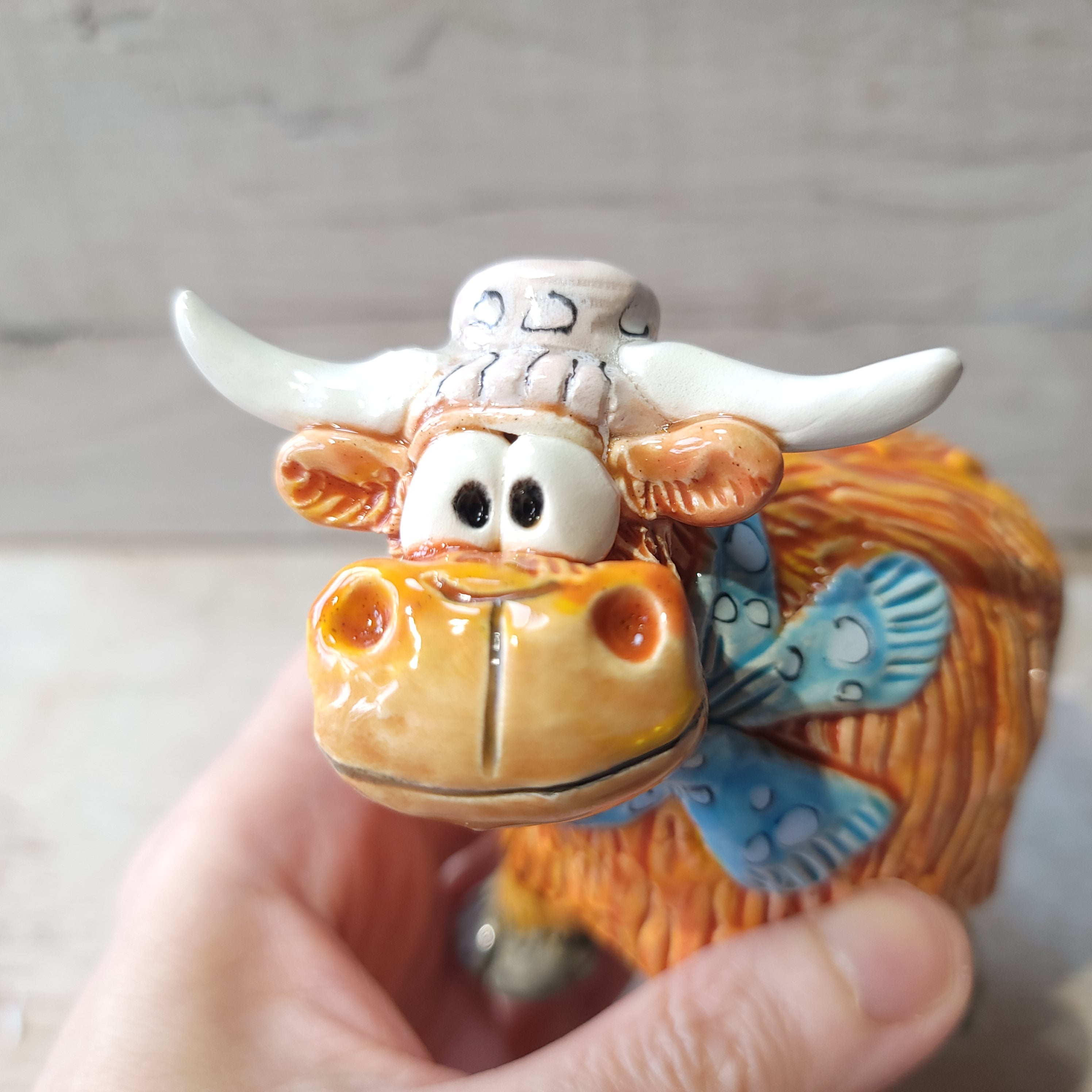 Little Highland cow, hat and scarf