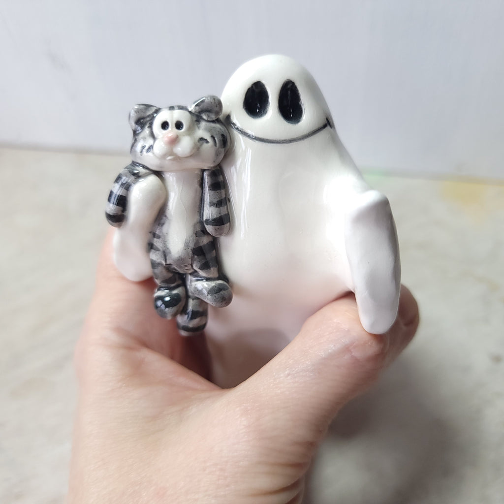 Ghost and tabby cat