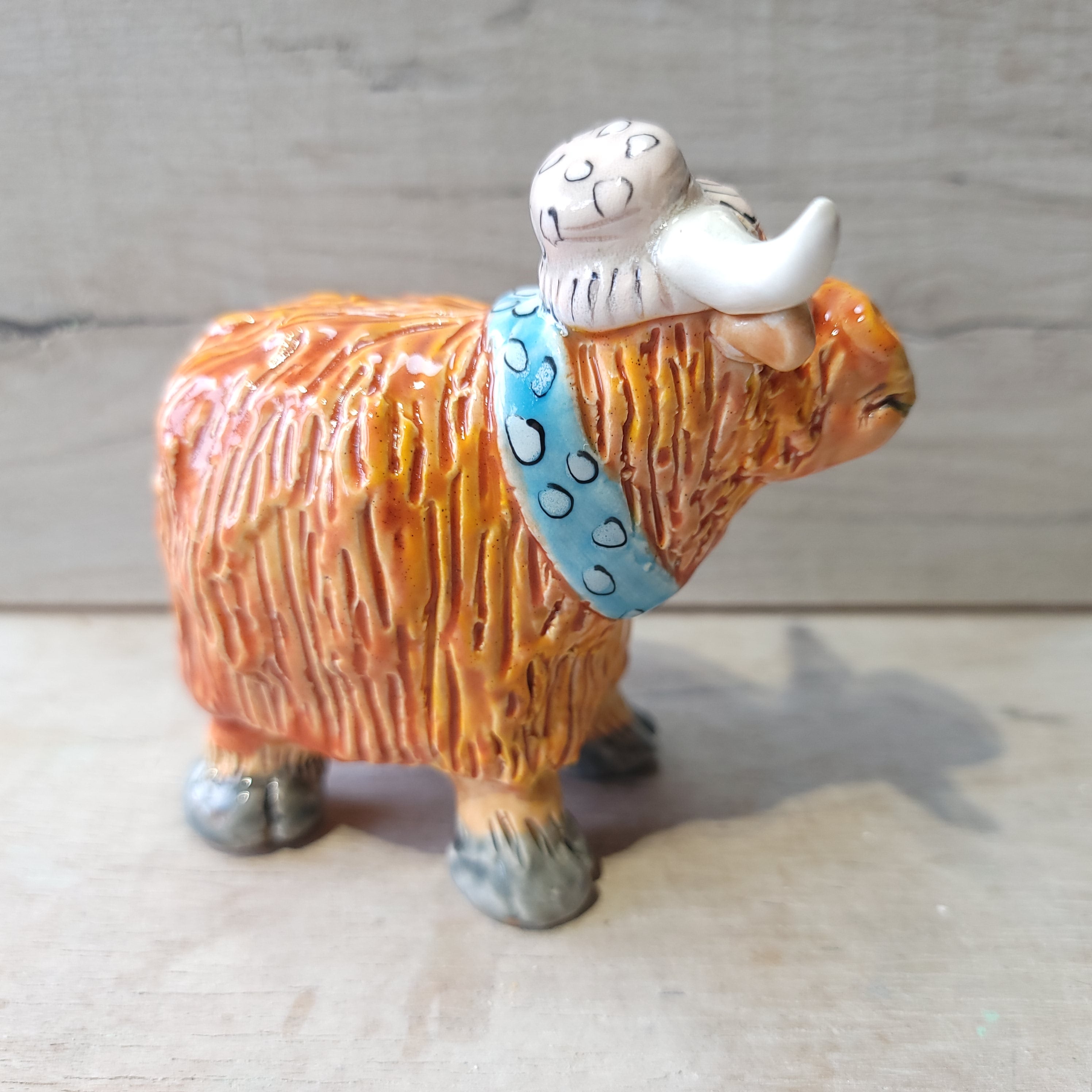 Little Highland cow, hat and scarf