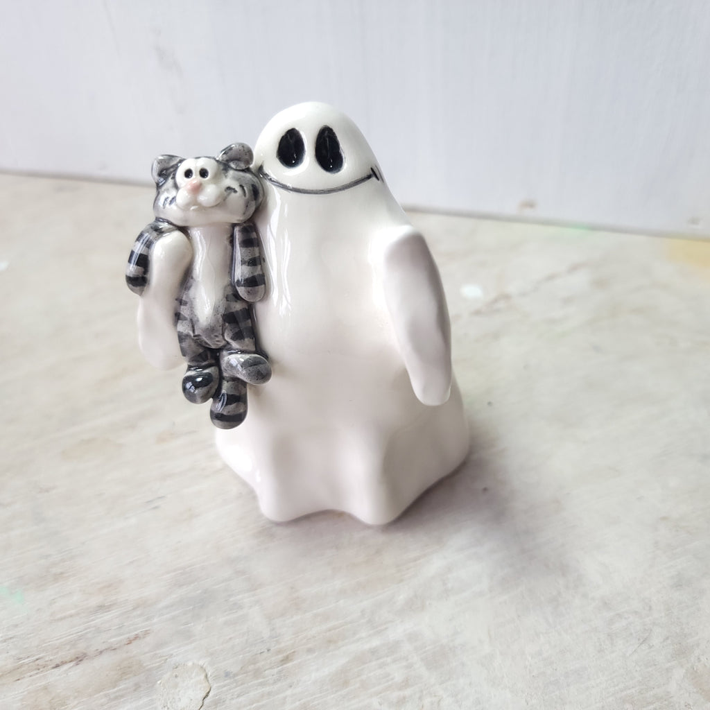 Ghost and tabby cat